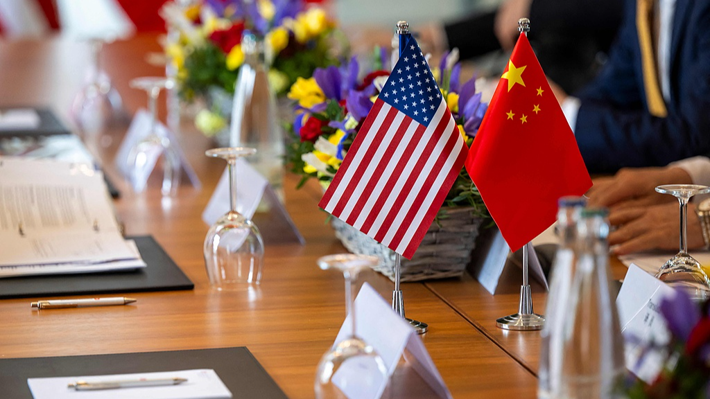 The photo shows Chinese and U.S. flags prior to a meeting between officials of the two countries to discuss trade and tariffs in Geneva, Switzerland, May 10, 2025. /CFP