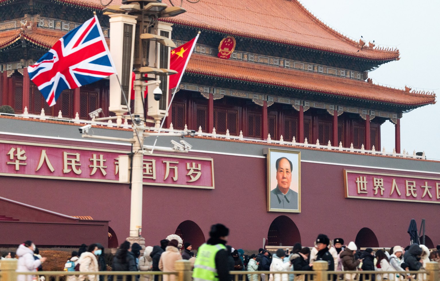 Chinese and British flags fly near Tiananmen Gate, with a portrait of Mao Zedong, during British Prime Minister Keir Starmer's visit to Beijing.
