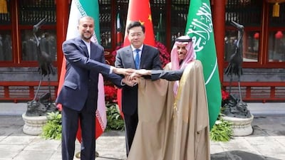 Former Iranian foreign minister Hossein Amir-Abdollahian and Saudi Arabia's Foreign Minister Prince Faisal bin Farhan and Chinese Foreign Minister Qin Gang shake hands during a meeting in Beijing. WANA